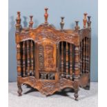 A French Provincial walnut hanging food cupboard carved with wheat and trailing leaf ornament and