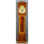An early 20th Century mahogany longcase clock of "Georgian" design, the 12.5ins arched brass dial