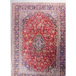 An Ardakan carpet of Kashan design woven in colours with a central lozenge shaped medallion, the