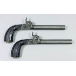 A pair of early 19th Century percussion travelling pistols, 5ins octagonal barrels finished with