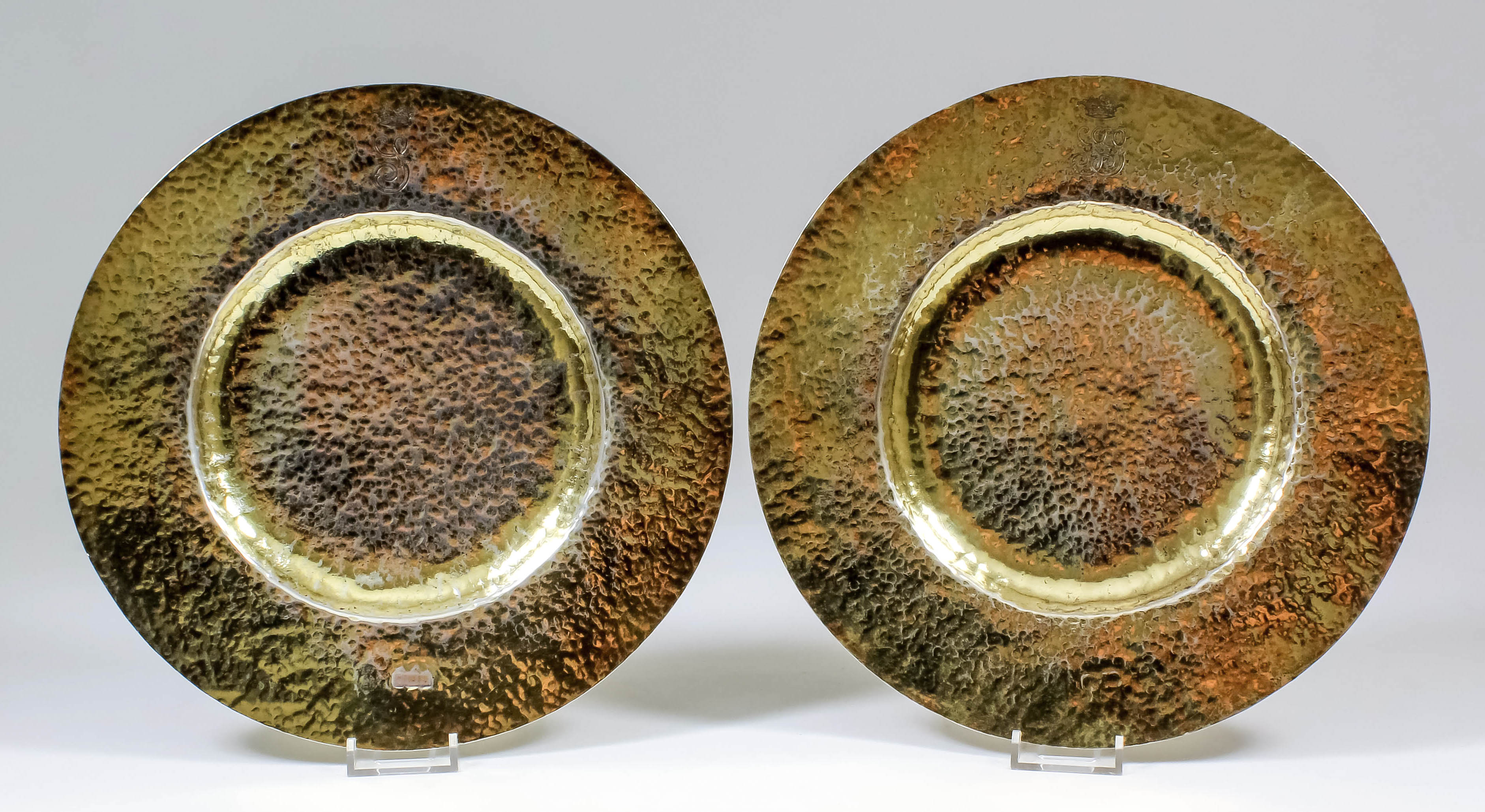 A pair of Edward VII silver gilt hand beaten circular plates, inscribed to back of one "Pair of
