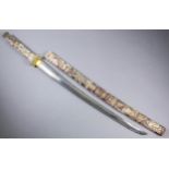 A 20th Century Japanese carved bone cased Wakizashi with 22ins bright steel blade (possibly