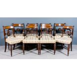 A set of eight George III mahogany dining chairs (including two armchairs with scroll arms), each