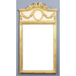 A French gilt and white painted rectangular wall mirror, the shaped and reeded top with ribbon and