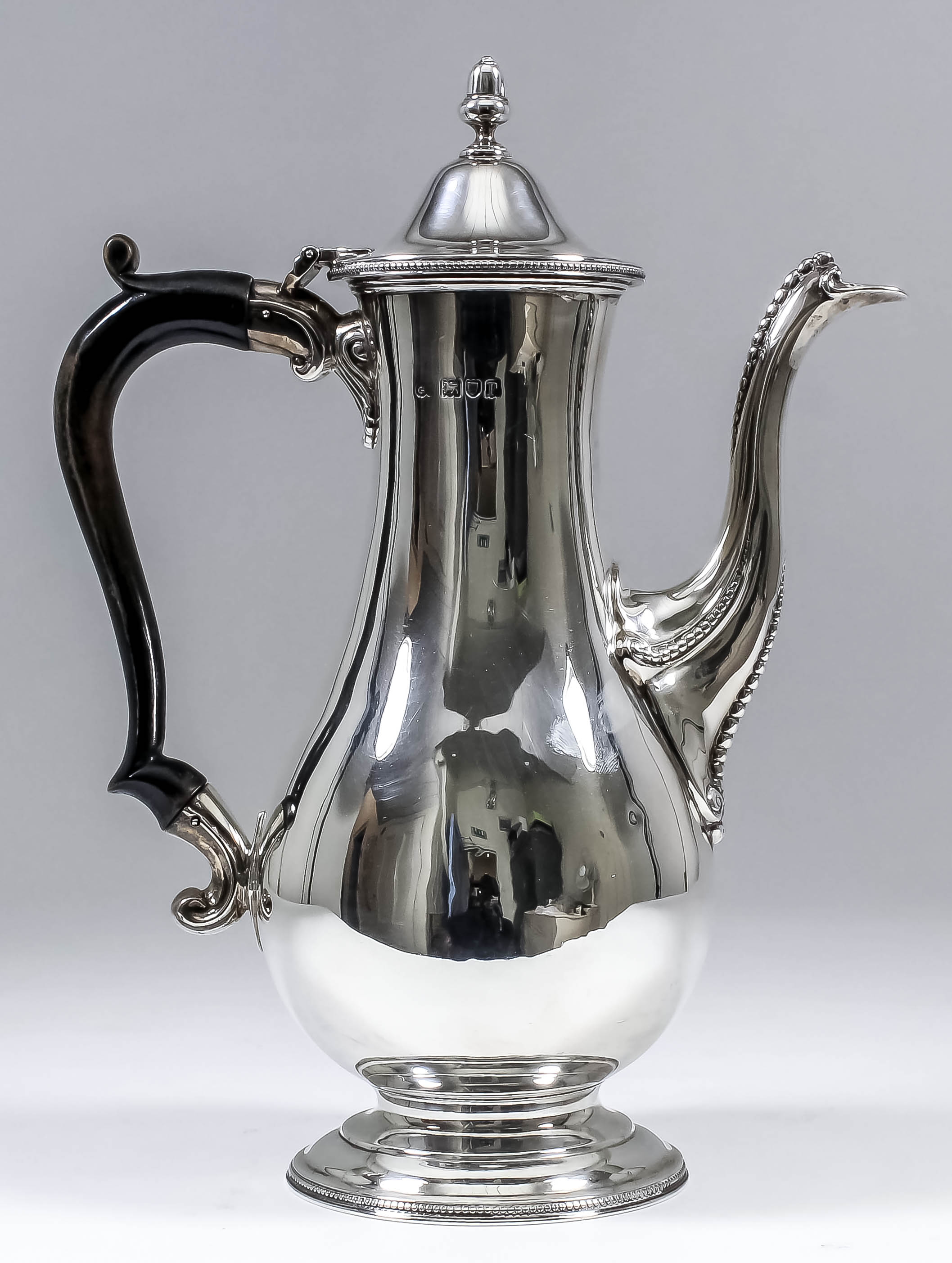 A George V silver baluster-shaped coffee pot with bead mounts, the slightly domed cover with acorn