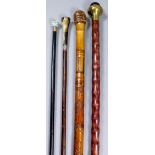 A late 19th/20th Century walking cane with silvery metal mount and turned and carved bone handle,