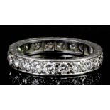 A modern silvery coloured metal mounted all diamond set full hoop eternity ring, the face set with