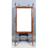 A George IV mahogany framed cheval mirror, the turned frame with rectangular reeded panels, the