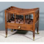 A George III mahogany rectangular three division Canterbury with dished top and shaped splats,