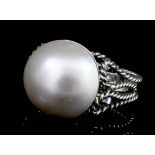 A modern silvery coloured metal mounted mabé pearl set ring, the pearl 13.7mm diameter (gross weight