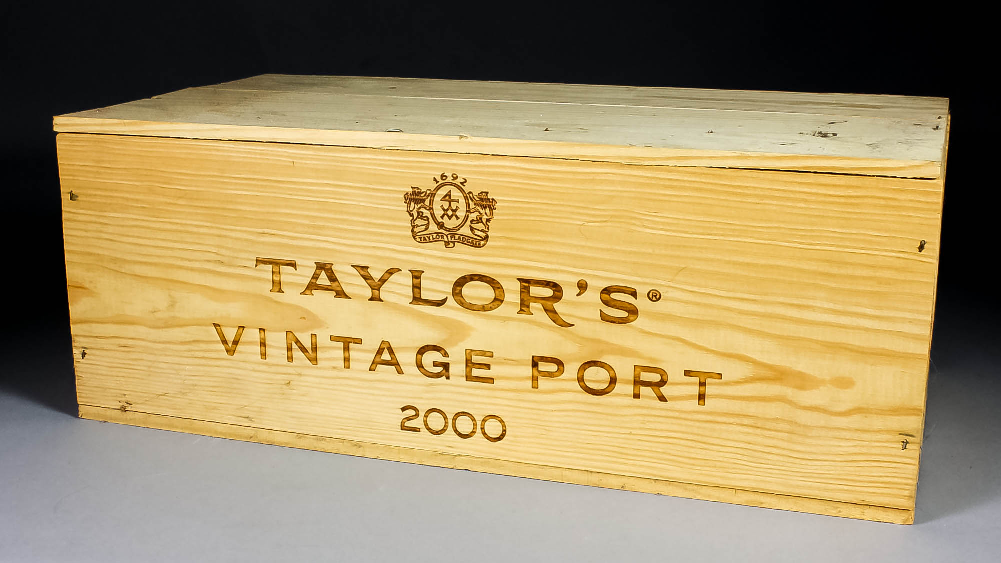 Twelve bottles of 2000 Taylor's Vintage Port (contained in two sealed six bottle wooden cases)