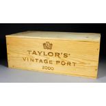 Twelve bottles of 2000 Taylor's Vintage Port (contained in two sealed six bottle wooden cases)