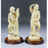 Two Japanese carved ivory Okimono of standing fisherman, one emptying the fish from his net, 7.75ins