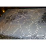 *A modern grey and white wool rug of abstract design, 8' x 6'