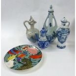 FOUR BLUE AND WHITE CHINA WINE JUGS AND AN AUSTRALIAN CHINA PLAQUE WITH PARROTS, 11" DIAMETER (5)