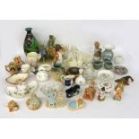 A QUANTITY OF DECORATIVE ORNAMENTS TO INCLUDE VARIOUS BISQUE FIGURES, MOORCRAFT ORNAMENTS, VARIOUS