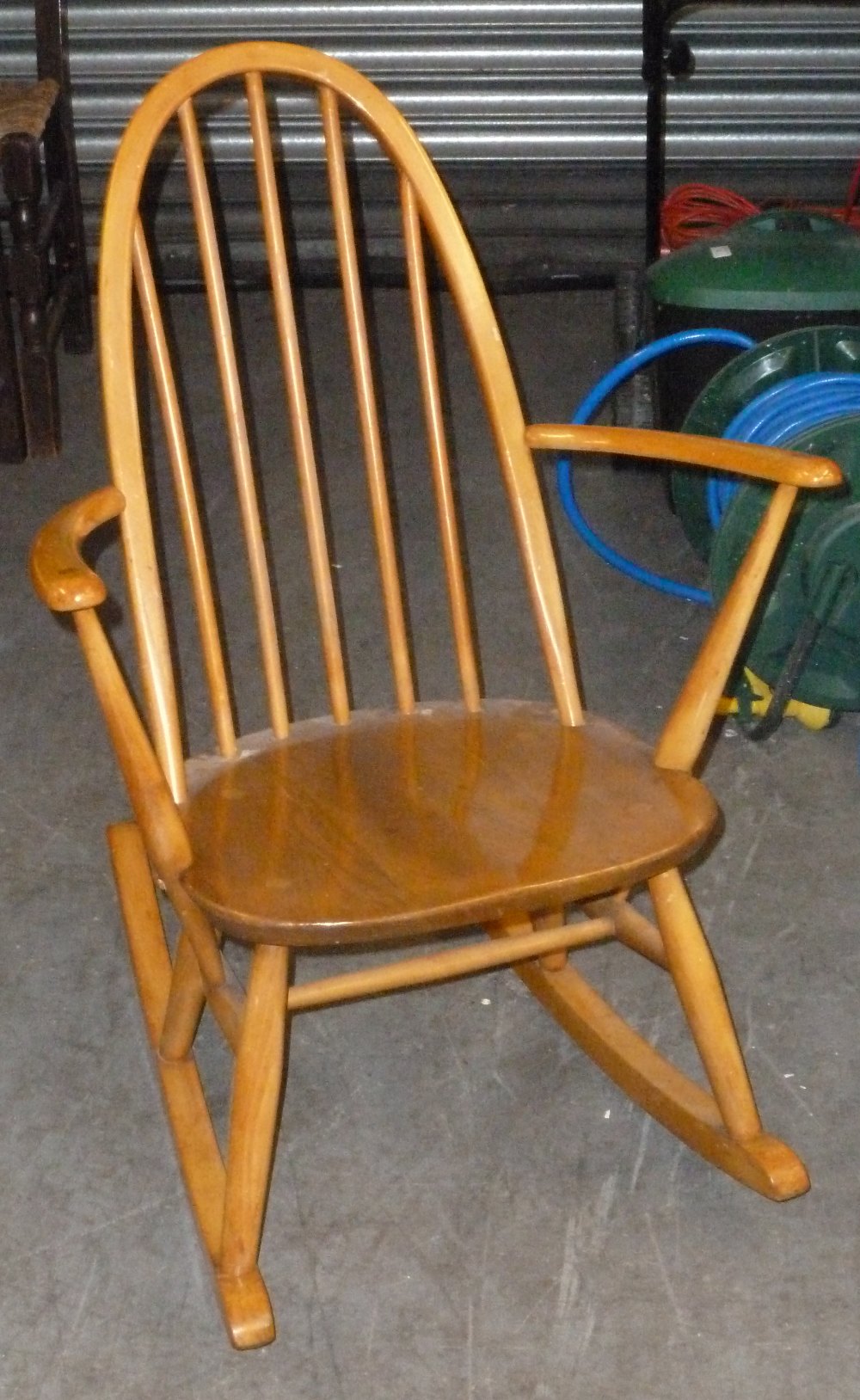 A BEECHWOOD SMALL ROCKING CHAIR