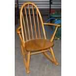 A BEECHWOOD SMALL ROCKING CHAIR