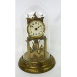 A GERMAN BRASS BALL CLOCK, CREAM DIAL WITH BLACK NUMERALS, FOUR BALL ROTATING MOVEMENT, ON