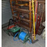 A QUALCAST ELECTRIC ROTARY LAWN MOWER, A GARDEN HOSE ON REEL AND GARDEN TOOLS