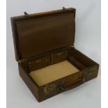 A LEATHER CLAD STATIONERY TRAVELLING CASE, WITH ACCORDION SLEEVE AND ADDRESS AND MEMORANDA BOOKS