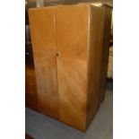 A LIGHT OAK TWO DOOR WARDROBE AND MATCHING DRESSING CHEST OF FOUR LONG DRAWERS AND MIRROR