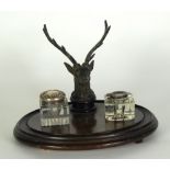 VICTORIAN STAINED FRUIT WOOD AND EBONISED INKSTAND, of oval form with well modelled stags head