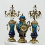 LARGE MODERN GILT METAL AND POTTERY CLOCK AND GARNITURE the side pieces in the form of five light