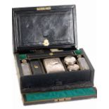 LADY' S LATE VICTORIAN BLACK MOROCCO CLAD TRAVELLING TOILET CASE with brass recessed carrying