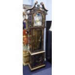A MODERN ORIENTAL CHINOSERIE LACQUERED LONGCASE CLOCK WITH A THREE TRAIN WEIGHT DRIVEN MOVEMENT.