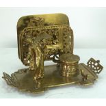 A LATE VICTORIAN CAST BRASS DESK STAND, with inkwell and letter rack, in the Japanesque style,