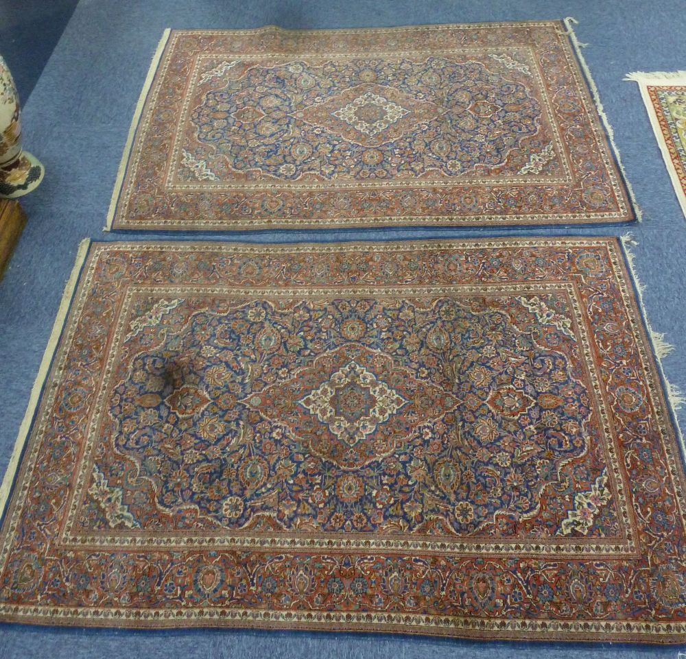 PAIR OF EARLY 20th CENTURY KASHAN PERSIAN RUGS each with concentric diamond shaped centre