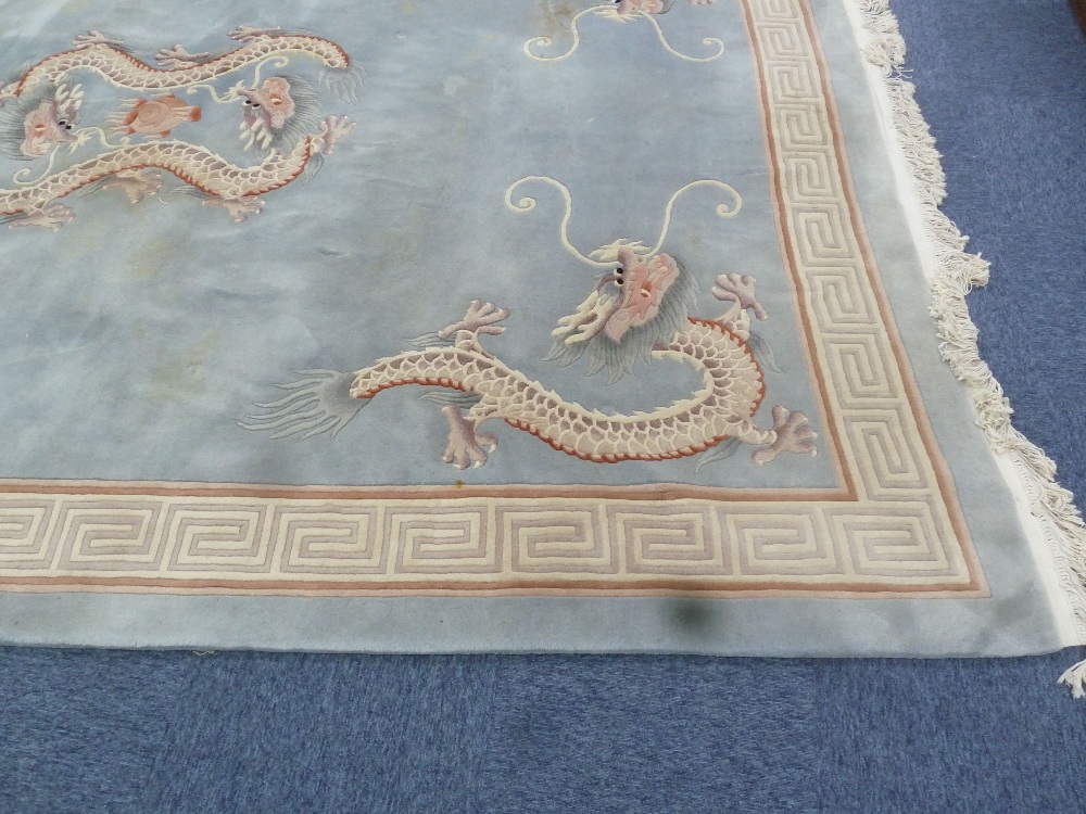 HEAVY QUALITY WASHED CHINESE CARPET, the plain pale blue/grey field embossed in the centre with - Image 2 of 2