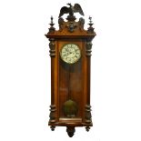 LATE NINETEENTH CENTURY FIGURED WALNUT CASED VIENNA WALL CLOCK, THE 7" ROMAN DIAL POWERED BY A