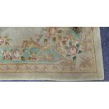 WASHED CHINESE SMALL CARPET, with embossed and multi colour Aubusson design with oval centre