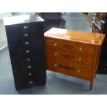 GRAINED WOOD CHEST OF THREE DRAWERS WITH BLACK STENCILED FLORAL DECORATION AND A PAINTED SEVEN