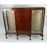 EARLY TWENTIETH CENTURY FIGURED MAHOGANY BREAKFRONT DISPLAY CABINET, the moulded top above a central