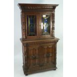 LATE NINETEENTH CENTURY CARVED OAK SIDE CABINET, the moulded cornice above a carved frieze and