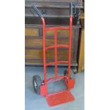 RED SACK TRUCK WITH INFLATABLE TIRES. HEIGHT 116CM.