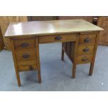 DISTRESSED ARTS AND CRAFT STYLE 7 DRAWER PEDESTAL DESK. HEIGHT 77CM, LENGTH 122CM.