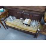 AN ANTIQUE SMALL OAK SETTLE