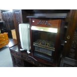 A COAL EFFECT REFLECTOR FIRE IN MAHOGANY CABINET AND AN OIL FILLED PANEL RADIATOR (2)