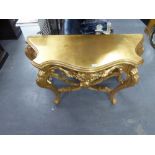 MODERN CARVED GILT WOOD SERPENTINE FRONTED SIDE TABLE, WITH FOLIATE SCROLL CARVED AND PIERCED