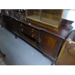 AN EARLY TWENTIETH CENTURY MAHOGANY BREAKFRONT SIDEBOARD WITH LEDGE BACK ON CABRIOLE LEGS