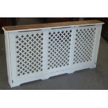 WHITE PAINTED RADIATOR COVER WITH TRIPLE PANELLED PIERCED FRONT AND TERRACOTTA TILED TOP, HEIGHT