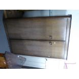 A LIMED OAK TWO DOOR WARDROBE, DRESSING TABLE EN-SUITE AND A BEDSIDE CUPBOARD AND STOOL (4)