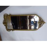 A WALL MIRROR IN GILT FRAME WITH FLEUR DE LYS PEDIMENT