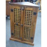 SHEESHAM WOOD DOUBLE DOOR STANDING CORNER CUPBOARD AND A LOW, POSSIBLY TEAK, CUPBOARD AND BOOKCASE