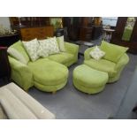 A LARGE THREE SEATER SETTEE WITH LEG REST AND A MATCHING SWIVEL CIRCULAR CHAIR WITH LEG REST, ALL IN