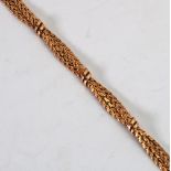 9ct GOLD BRACELET, of two entwined chevron pattern strands tied by five two strand ribbon cross